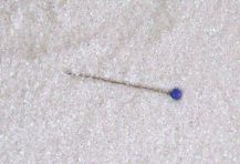 Obrázek k výrobku 16606 - Fluorescentní glitr bílý, prům. 0,2 mm